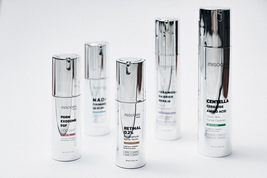 The five MISOORA bottles standing in a row on a white surface