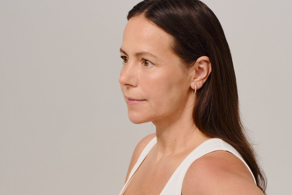 Profile of a woman in her 50s showing the jawline and neck